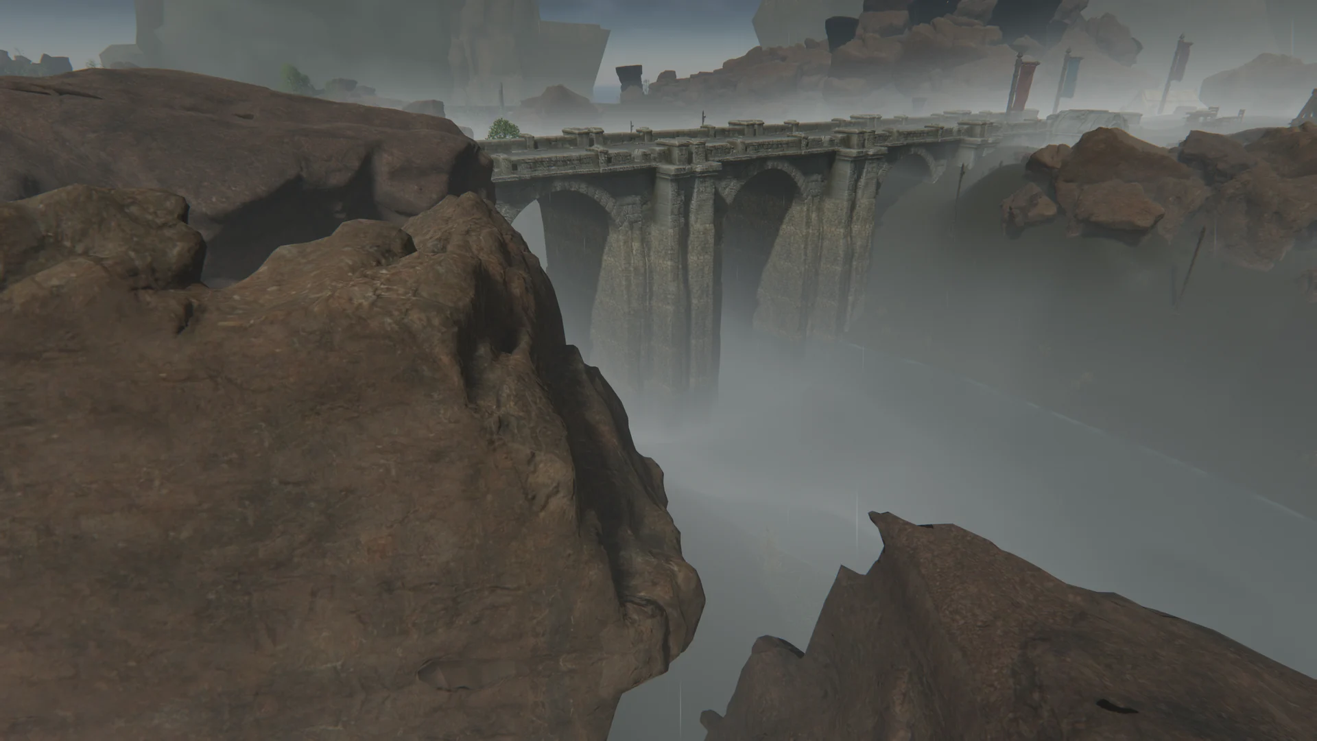 A long stone bridge stretches across a rocky gorge filled with mist.